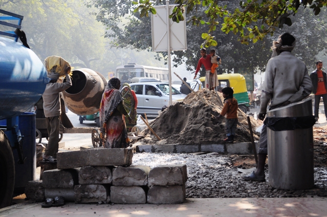 Such scenes of a husband and wife working at a construction site with their children is a common site in India. It is here that the kids start working early as child labour. Photo by C. Rahul in New Delhi. Such scenes of a husband and wife working at a construction site with their children is a common site in India. It is here that the kids start working early as child labour. Photo by C. Rahul in New Delhi.